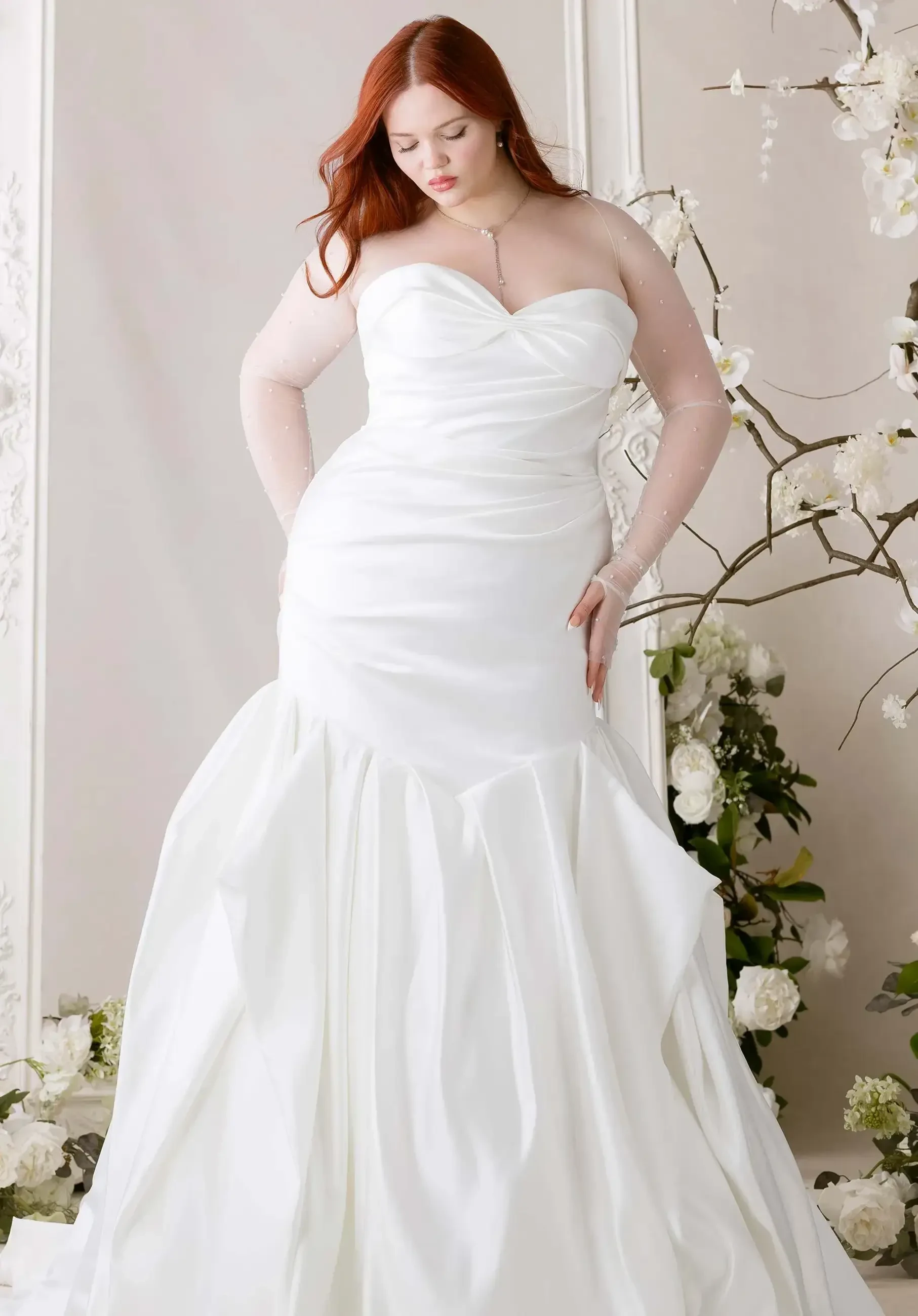 model is wearing a strapless bridal gown