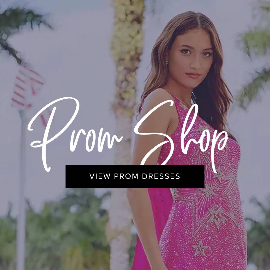 Model wearing a dark pink prom dress