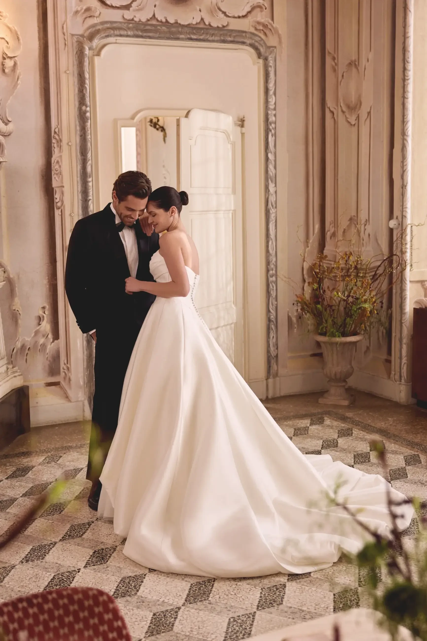 model is wearing a ball gown wedding dress