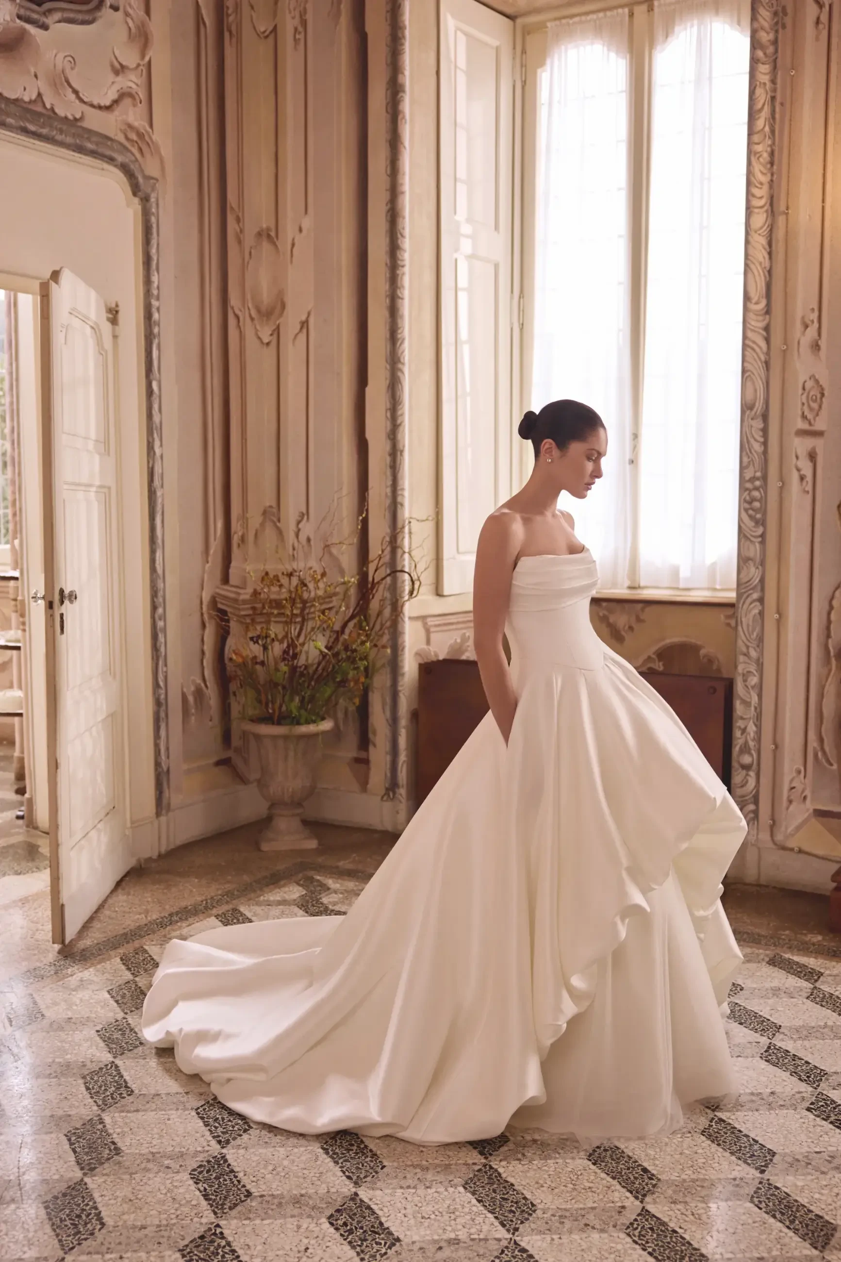 model is wearing a ball gown wedding dress