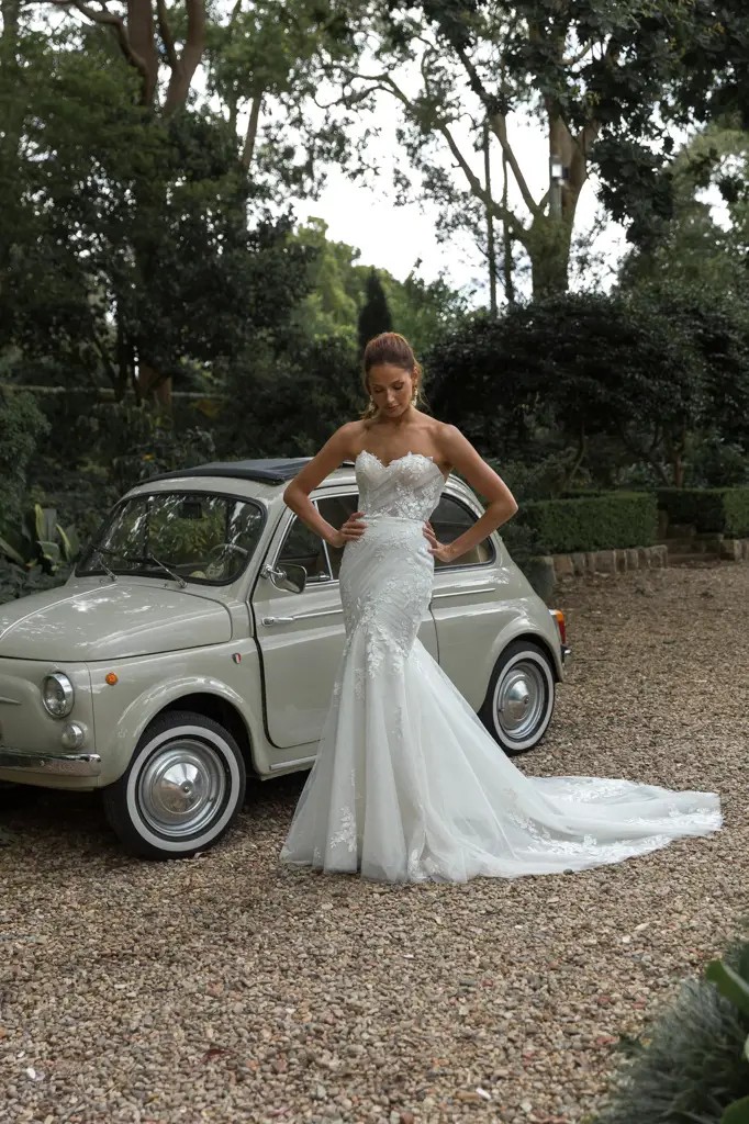 Model wearing a white Madi Lane Gown